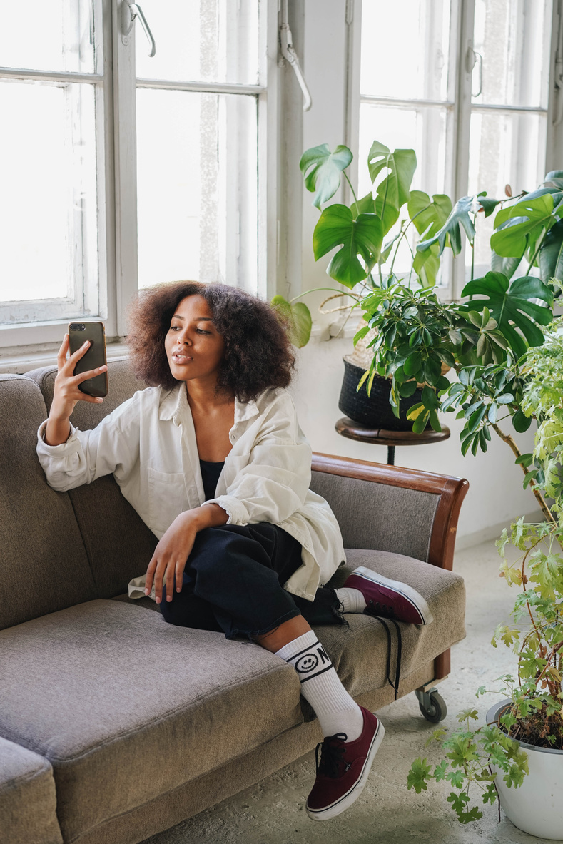 Woman Taking a Selfie with Her Houseplants